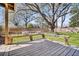 Beautiful backyard with bench seating and a wooden deck, perfect for outdoor relaxation at 1950 Culver Ave, Charleston, SC 29407