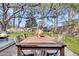 Spacious backyard features a large wooden table and a cozy firepit area for entertaining at 1950 Culver Ave, Charleston, SC 29407