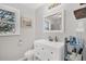 Bright bathroom with a modern vanity, toilet and a window providing natural light at 1950 Culver Ave, Charleston, SC 29407