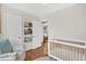 Bright Bedroom features hardwood floors, shelving and a crib with a comfy chair at 1950 Culver Ave, Charleston, SC 29407