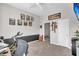 Bedroom featuring an exercise bike, wall decor, and a door leading to stairs at 1950 Culver Ave, Charleston, SC 29407