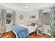 Bedroom with hardwood floors, natural light, and stylish decor at 1950 Culver Ave, Charleston, SC 29407