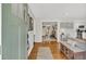 View of an open-concept entryway with hardwood floors leading to the dining and living areas at 1950 Culver Ave, Charleston, SC 29407