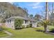 Charming single-story home with manicured lawn, mature landscaping, and a welcoming front entrance at 1950 Culver Ave, Charleston, SC 29407