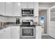 Kitchen featuring stainless steel appliances, granite countertops and white cabinets at 1950 Culver Ave, Charleston, SC 29407