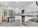 Bright kitchen with stainless steel appliances, white cabinets, and stone countertops at 1950 Culver Ave, Charleston, SC 29407