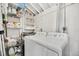 Functional laundry area with washer, dryer, shelving and ample storage space at 1950 Culver Ave, Charleston, SC 29407