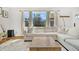 Bright and airy living room featuring a comfortable sofa, large windows, and hardwood floors at 1950 Culver Ave, Charleston, SC 29407