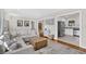Comfortable living room with open floor plan, hardwood floors, and stylishly connecting kitchen at 1950 Culver Ave, Charleston, SC 29407