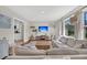 Inviting living room featuring a large sectional sofa, hardwood floors, and abundant natural light at 1950 Culver Ave, Charleston, SC 29407