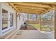 Covered patio area features an open ceiling, fan, and a lovely view of the fenced backyard at 1950 Culver Ave, Charleston, SC 29407