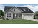 Charming single-Gathering home with manicured lawn, two-car garage, and inviting front porch at 2009 Sea Water Dr, Charleston, SC 29412