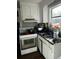 Functional kitchen featuring white cabinetry and essential appliances at 2011 Hugo Ave, North Charleston, SC 29405