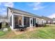 Backyard featuring patio, screened porch, landscaping, and privacy fence at 2012 Barn Swallow Rd, Summerville, SC 29483