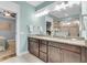 Bright bathroom boasts double vanity, granite counters, and a tile shower at 2012 Barn Swallow Rd, Summerville, SC 29483