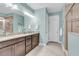 Bright bathroom features double vanity, granite counters, and large mirrors at 2012 Barn Swallow Rd, Summerville, SC 29483
