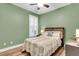 A cozy bedroom with green walls, plantation shutters, and comfortable, inviting decor at 2012 Barn Swallow Rd, Summerville, SC 29483
