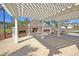 Outdoor fireplace under a pergola, perfect for gatherings and relaxation at 2012 Barn Swallow Rd, Summerville, SC 29483
