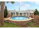 Relaxing outdoor hot tub with a stylish pergola in a tranquil community setting at 2012 Barn Swallow Rd, Summerville, SC 29483