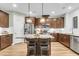 Kitchen with a center island, stainless steel appliances, granite countertops and custom cabinets at 2012 Barn Swallow Rd, Summerville, SC 29483