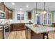 Kitchen island with granite counters and a view of the open-concept dining area at 2012 Barn Swallow Rd, Summerville, SC 29483