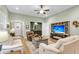 Cozy living room with a ceiling fan, a comfortable seating area, and an open floor plan with light green walls at 2012 Barn Swallow Rd, Summerville, SC 29483