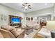 Comfortable living room with a ceiling fan, a cozy seating area, and an open view of the kitchen and dining space at 2012 Barn Swallow Rd, Summerville, SC 29483