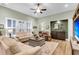 Cozy living room featuring bright natural light and an open floor plan with light green walls and white trim at 2012 Barn Swallow Rd, Summerville, SC 29483