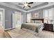 Luxurious main bedroom suite featuring tray ceiling, neutral paint, and an ensuite bathroom with a glass shower at 2012 Barn Swallow Rd, Summerville, SC 29483