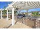 Outdoor kitchen with grill, countertop space, and storage, ideal for entertaining at 2012 Barn Swallow Rd, Summerville, SC 29483