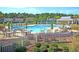 Large community pool with ample seating and umbrellas for residents to enjoy at 2012 Barn Swallow Rd, Summerville, SC 29483