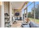 Cozy screened porch with comfortable seating, string lights, and outdoor views at 2012 Barn Swallow Rd, Summerville, SC 29483