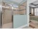 Walk-in shower with tile surround, glass door, and a view into the bedroom at 2012 Barn Swallow Rd, Summerville, SC 29483