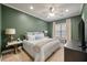 Cozy bedroom featuring a king-sized bed, green walls, recessed lighting, and a window seat for added comfort at 204 Branch Creek Trl, Summerville, SC 29483