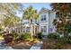 Charming townhome with well-maintained landscaping and a welcoming red front door at 204 Branch Creek Trl, Summerville, SC 29483