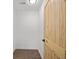 This hallway features modern flooring and a beautiful wooden door at 2124 Booker St, Charleston, SC 29405