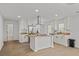 Bright kitchen features stainless appliances, butcher block countertops, and eat-in island at 2124 Booker St, Charleston, SC 29405