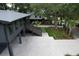 Aerial view showcasing the home, landscaped yard, and brick driveway, highlighting its prime location and curb appeal at 219 Forest Trl, Isle of Palms, SC 29451