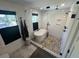 Modern bathroom featuring a freestanding tub, glass shower, and neutral tile flooring, offering a spa-like experience at 219 Forest Trl, Isle of Palms, SC 29451