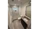 A sleek bathroom features a glass-enclosed shower, modern fixtures, and neutral tones for a spa-like experience at 219 Forest Trl, Isle of Palms, SC 29451