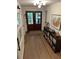 Welcoming entryway features hardwood floors, stylish decor, and ample lighting, creating a warm first impression at 219 Forest Trl, Isle of Palms, SC 29451