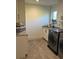 Functional laundry room with white cabinetry, gray countertops, modern sink, and matching washer and dryer at 219 Forest Trl, Isle of Palms, SC 29451
