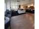 Open floorplan featuring vaulted ceilings and hardwood floors. Kitchen is attached to the living room space at 219 Forest Trl, Isle of Palms, SC 29451