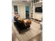 Cozy playroom featuring a sofa, a large area rug and built in bookshelves with ample storage at 219 Forest Trl, Isle of Palms, SC 29451