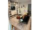 Spacious playroom features built-in shelves, soft rug, and is well-lit with a contemporary standing lamp at 219 Forest Trl, Isle of Palms, SC 29451