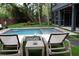 Relaxing pool area with lounge chairs, creating a perfect outdoor retreat for relaxation and enjoyment at 219 Forest Trl, Isle of Palms, SC 29451