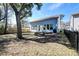 Spacious backyard featuring a patio and mature tree at 2317 Chisol Plow St, Mount Pleasant, SC 29466