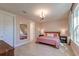 Bright bedroom featuring hardwood floors, modern chandelier, and ample natural light at 2317 Chisol Plow St, Mount Pleasant, SC 29466