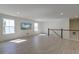 Bright bonus room with wood floors and large windows allowing ample natural light at 2317 Chisol Plow St, Mount Pleasant, SC 29466