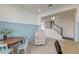 Inviting dining area features light wood flooring and stylish wainscoting leading to the staircase at 2317 Chisol Plow St, Mount Pleasant, SC 29466